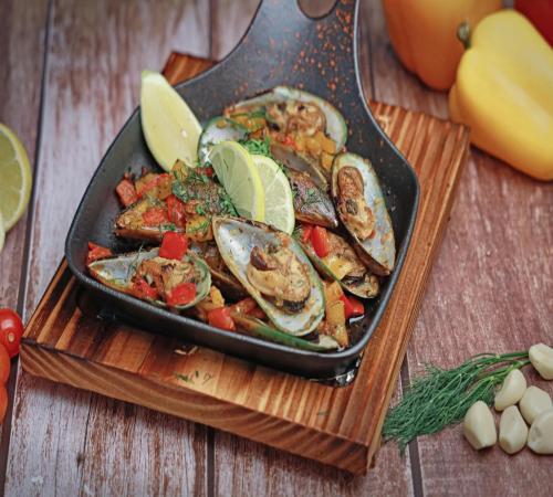 Professional cake decorating workspace with various tools and ingredients